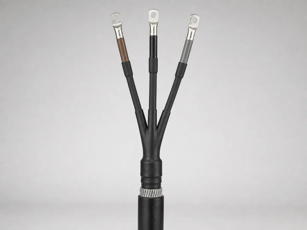 Brand-neutral generated catalog visual of Heat-shrink terminations: installed three-core heat-shrink cable termination with breakout, stress-control tubes, insulated tails, and lugs.