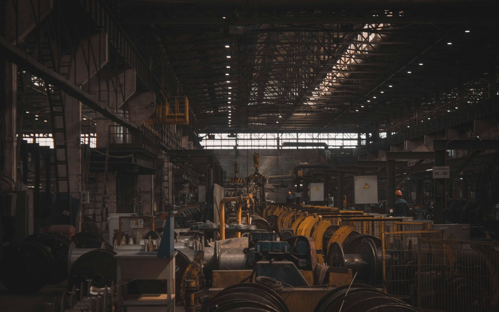 Organized machinery and production equipment inside an industrial plant.